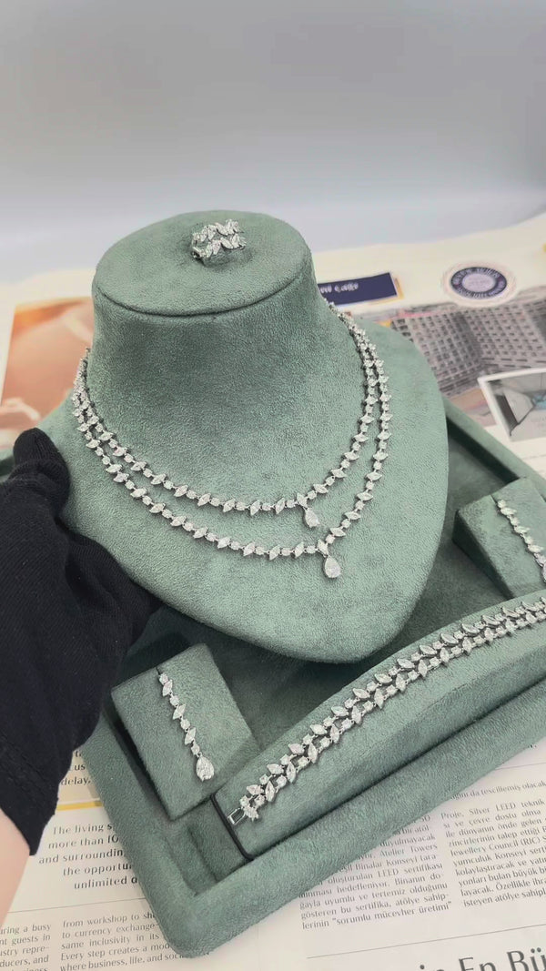 Mireya bridal jewelry set video showing the double layer marquise tennis necklace earrings bracelet and adjustable ring