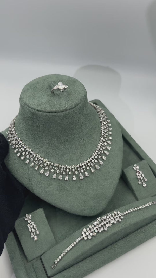 Esmara statement bridal jewelry set video showing the teardrop fringe necklace chandelier earrings matching bracelet and adjustable ring