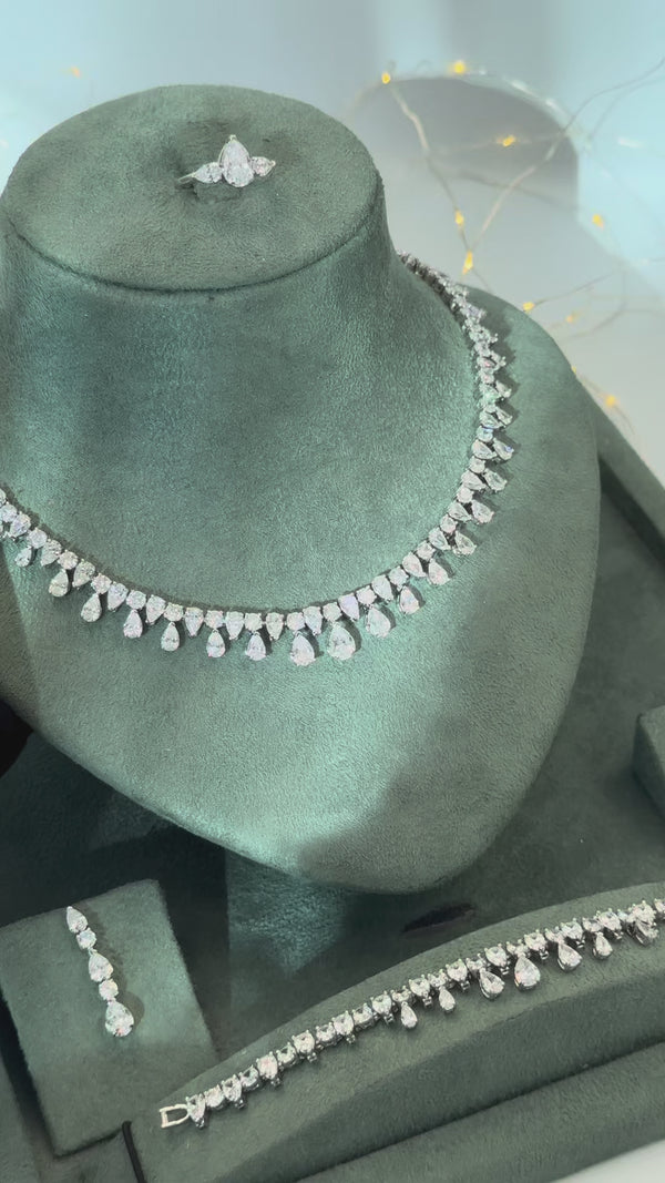 Noelia bridal jewelry set video showing the pear cut teardrop fringe necklace earrings tennis bracelet and adjustable ring
