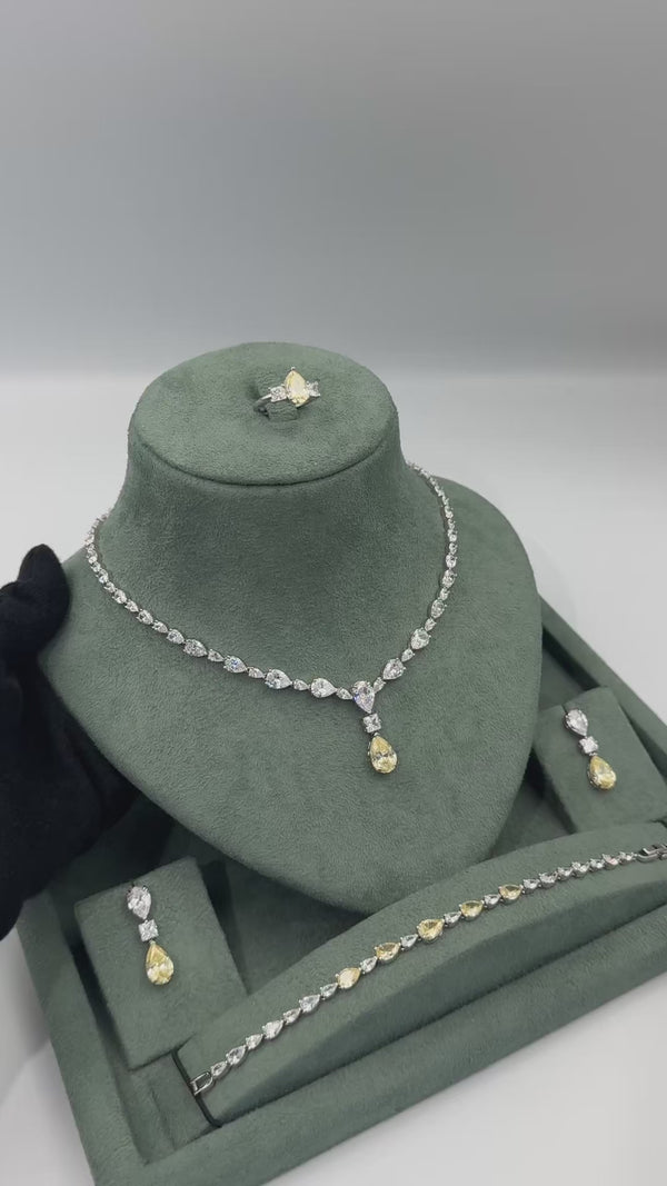 Meliora bridal wedding jewelry set video showing the yellow pear-cut tennis necklace, earrings, bracelet and adjustable ring