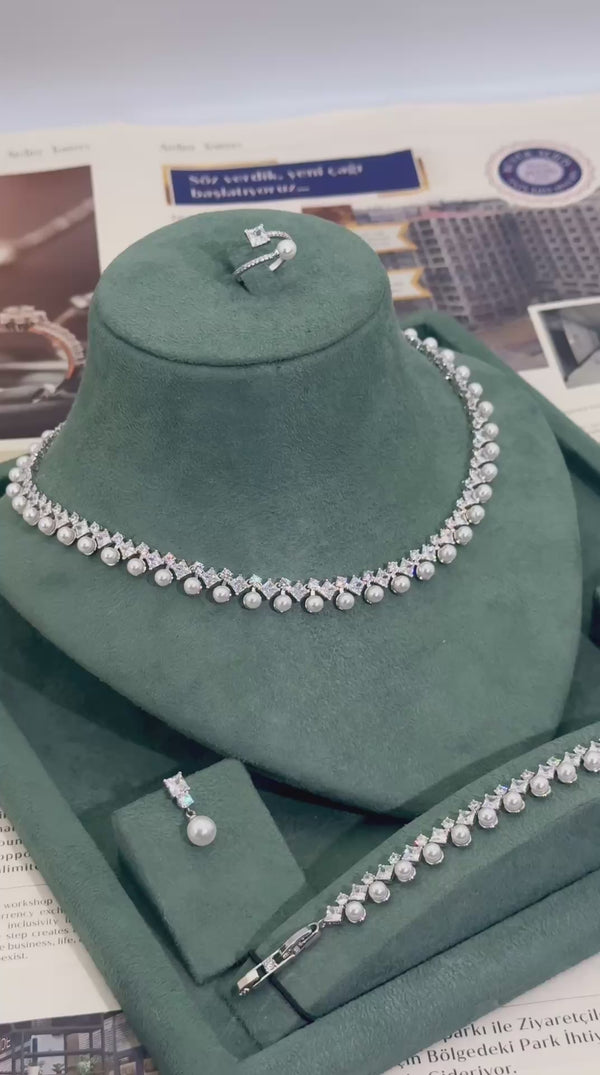 Elegant bridal pearl jewelry set with necklace earrings bracelet and ring