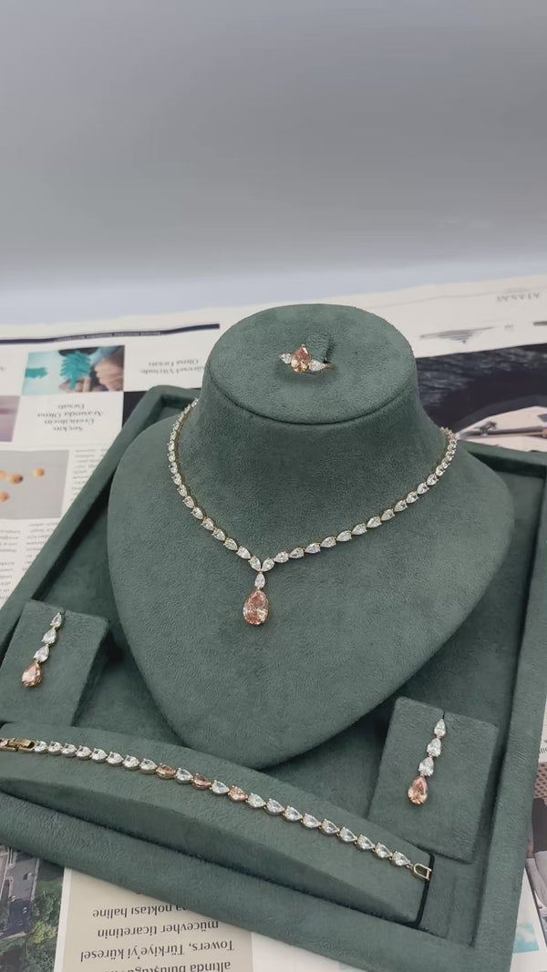 Ambria bridal jewelry set video showing the champagne teardrop tennis necklace earrings bracelet and adjustable ring