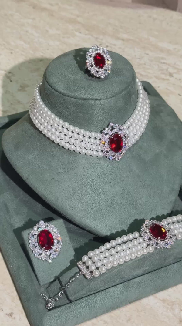 Luxury bridal pearl choker jewelry set with red zircon centerpiece and elegant wedding design