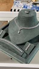 Monaco luxury bridal jewelry set with teardrop pendant necklace and matching earrings, rhodium plated with diamond-look cubic zirconia.