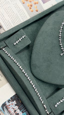 Side detail of minimal bridal jewelry set with fine crystal line
