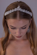 Botanical pearl bridal crown shown from the opposite side, featuring clear beaded branches and a slim silver-tone base.
