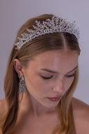 Graduated bridal tiara with luminous AAAA zircon vines framing a softly styled wedding hairstyle