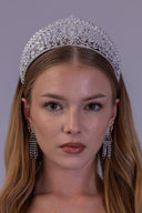 A woman wearing a sparkling silver rhinestone tiara