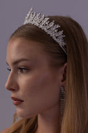 Side view of a silver fern bridal tiara with layered zircon branches, designed as an elegant statement crown for brides