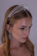 Right angled view of a silver wedding tiara featuring graduated zircon rows and oval stones along its upper edge
