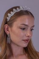 Silver zircon bridal tiara worn by a bride, featuring a symmetrical leaf design for an elegant luxury wedding look
