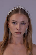 elegant botanical bridal tiara with symmetrical zircon leaves and a raised center framing the bride.