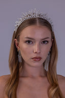 Close angled view of an openwork botanical wedding headpiece with sparkling clear zircon leaves