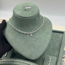 Close view of delicate teardrop necklace with small center drop