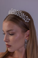 Detailed close-up of a silver wedding tiara with teardrop zircon stones rising above marquise-shaped zircon leaves.