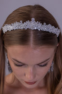 Left-side view of the low-profile silver-plated wedding tiara with detailed zircon leaves and floral accents