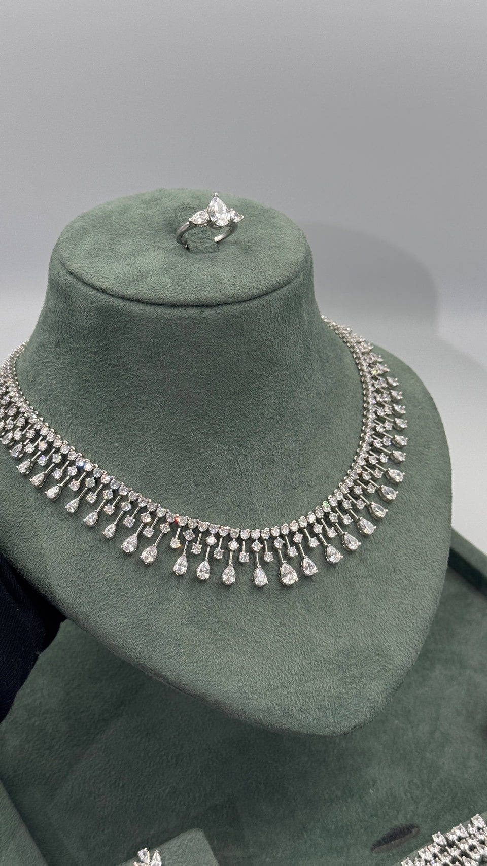 Statement bridal necklace with graduated round and pear cut zircon fringe in a dramatic collar design