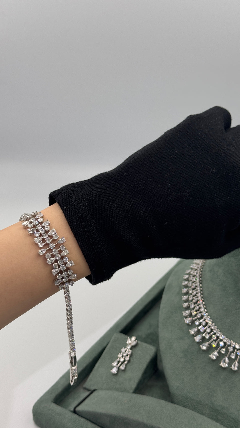 Wide clear zircon teardrop fringe bridal bracelet worn on the wrist with tennis chain sides