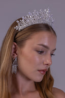 Luxury wedding crown for a bride shown in profile, highlighting its silver base and sparkling teardrop zircon arrangement.