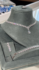 Monaco luxury bridal jewelry set with teardrop pendant necklace and matching earrings, rhodium plated with diamond-look cubic zirconia.