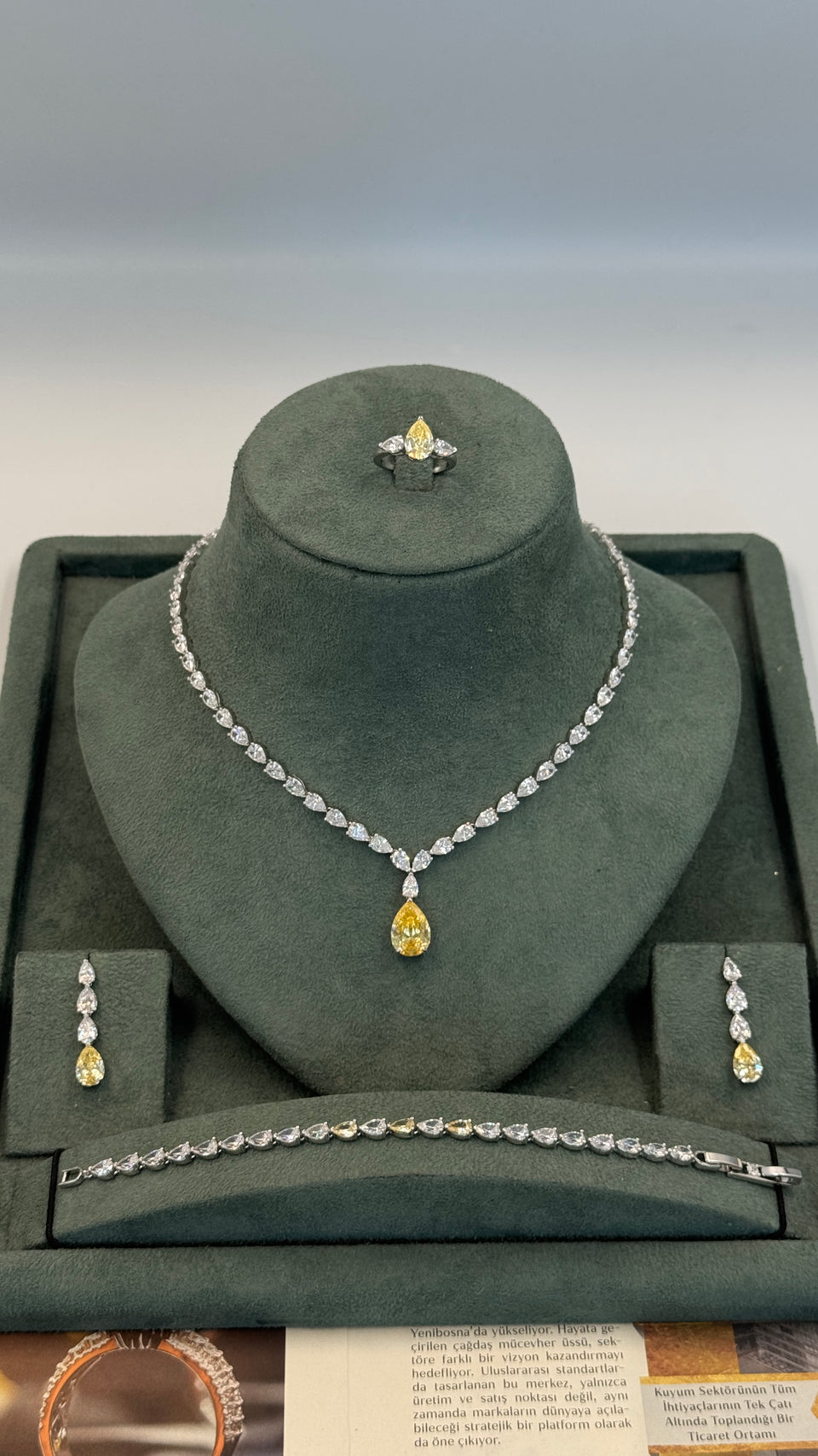 Bridal teardrop necklace yellow crystal detail close up wedding sparkle