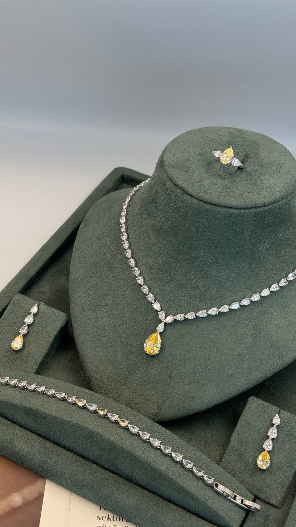 Bridal Swarovski yellow teardrop necklace close up luxury shine