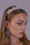 Bride in side profile wearing a regal silver-plated foliage tiara for her wedding look
