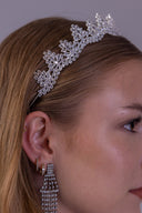 Close side view of a silver leaf bridal crown with brilliant zircon detailing for an elegant and luxurious wedding style